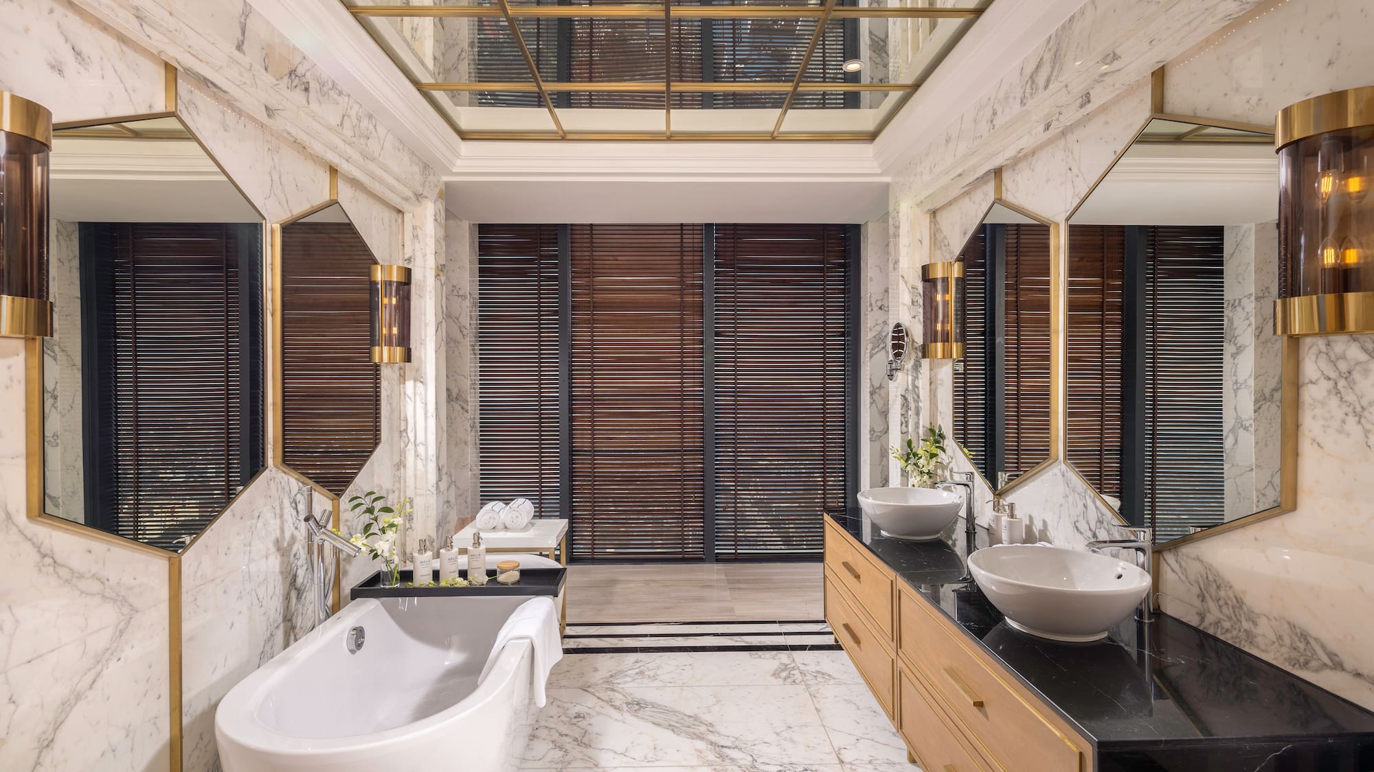 a bathroom with marble walls and a tub