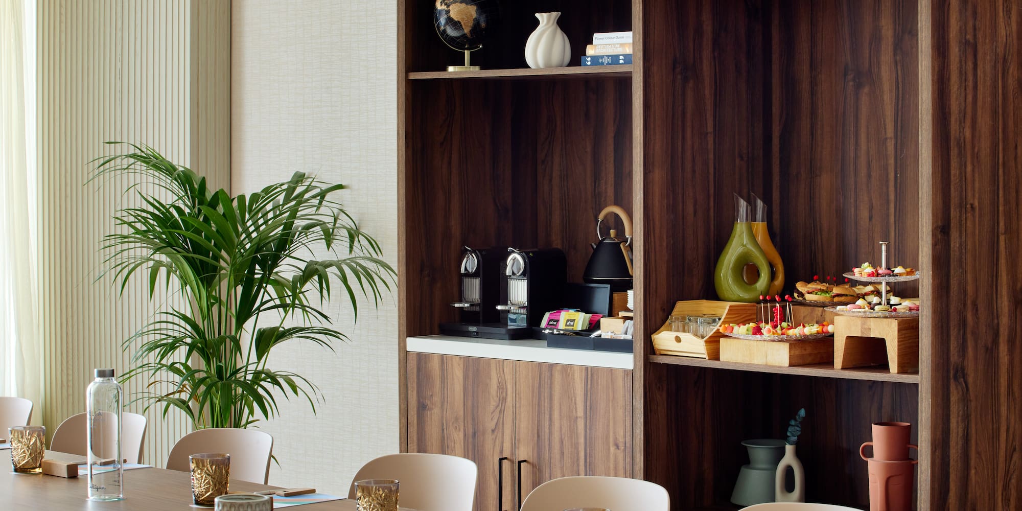 a room with a table and shelves with food items