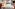 Bright modern hotel room with king bed, window view, and contemporary decor.