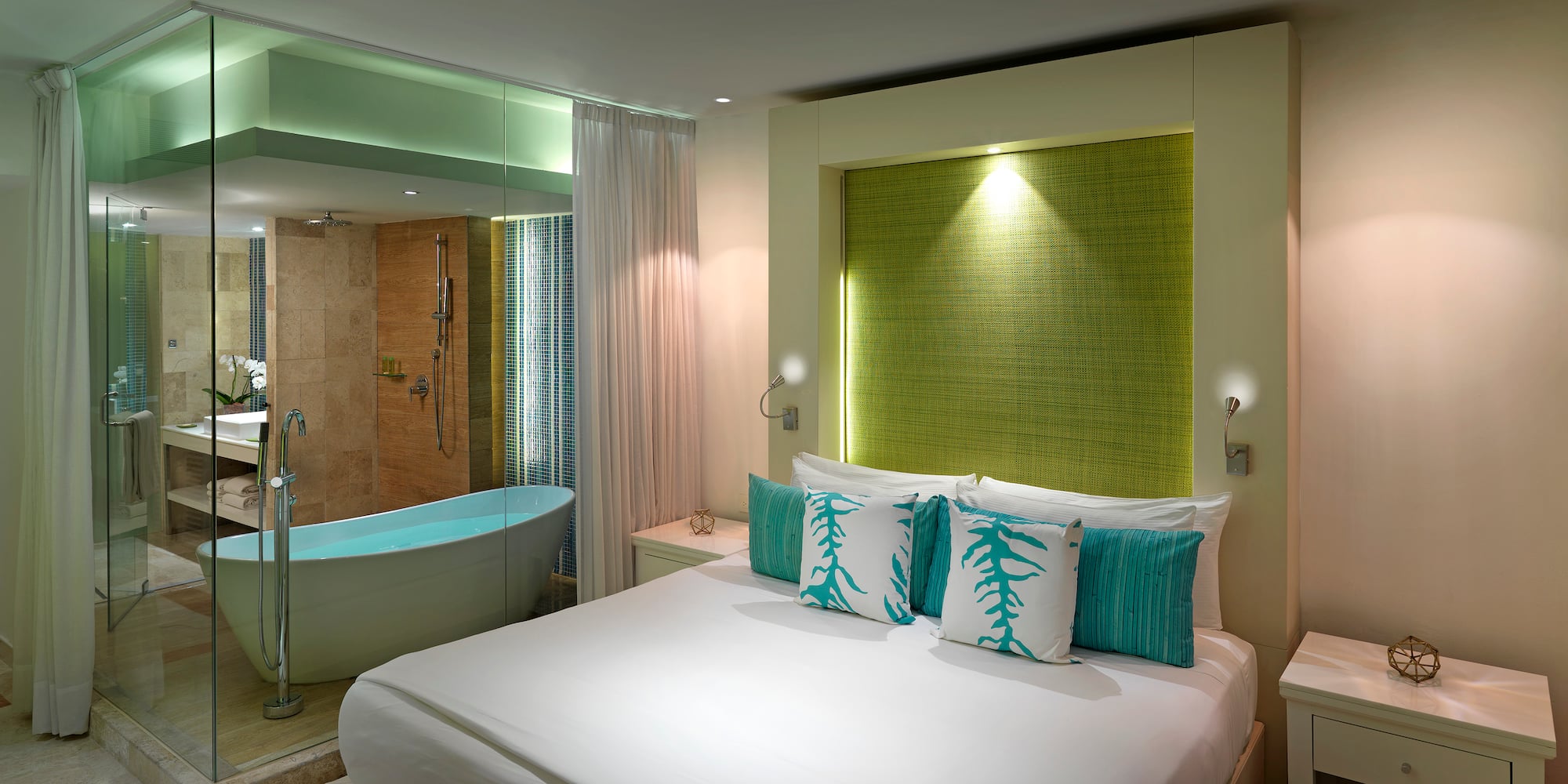 a bedroom with a bathtub and a bed