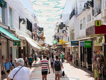 a group of people walking down a street