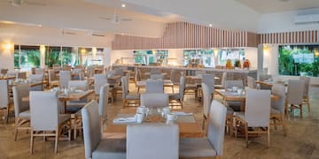 a room with tables and chairs