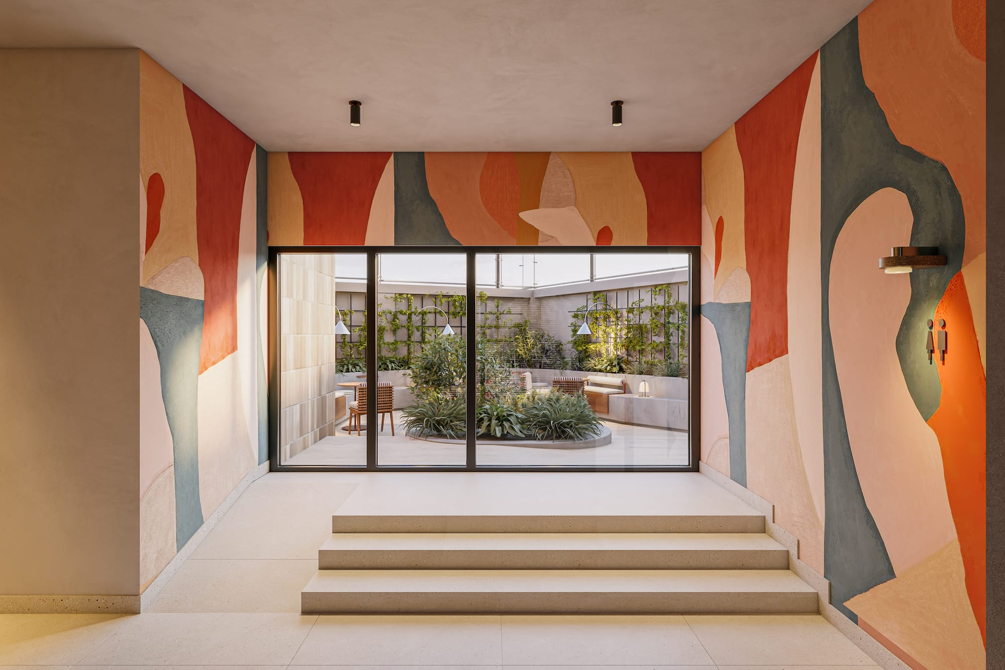 Colorful abstract mural in modern entryway, leading to green outdoor patio.