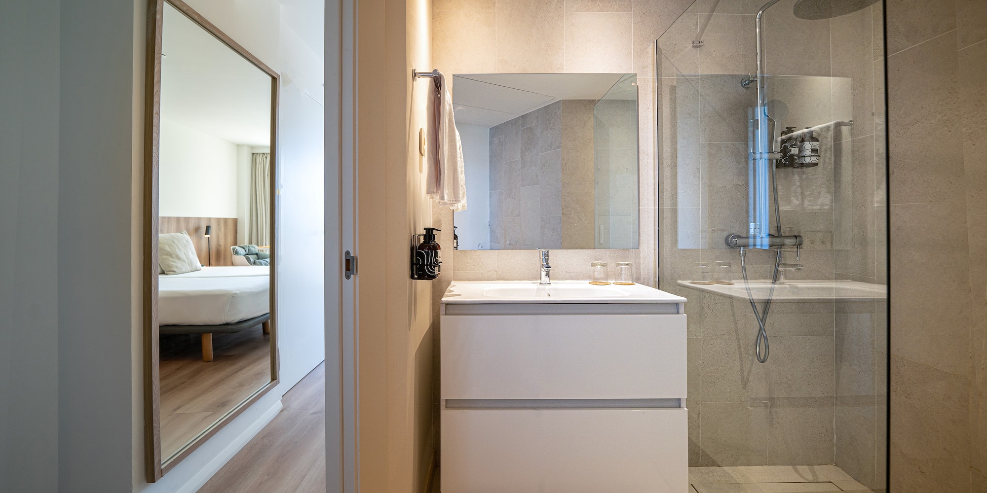 a bathroom with a mirror and a sink
