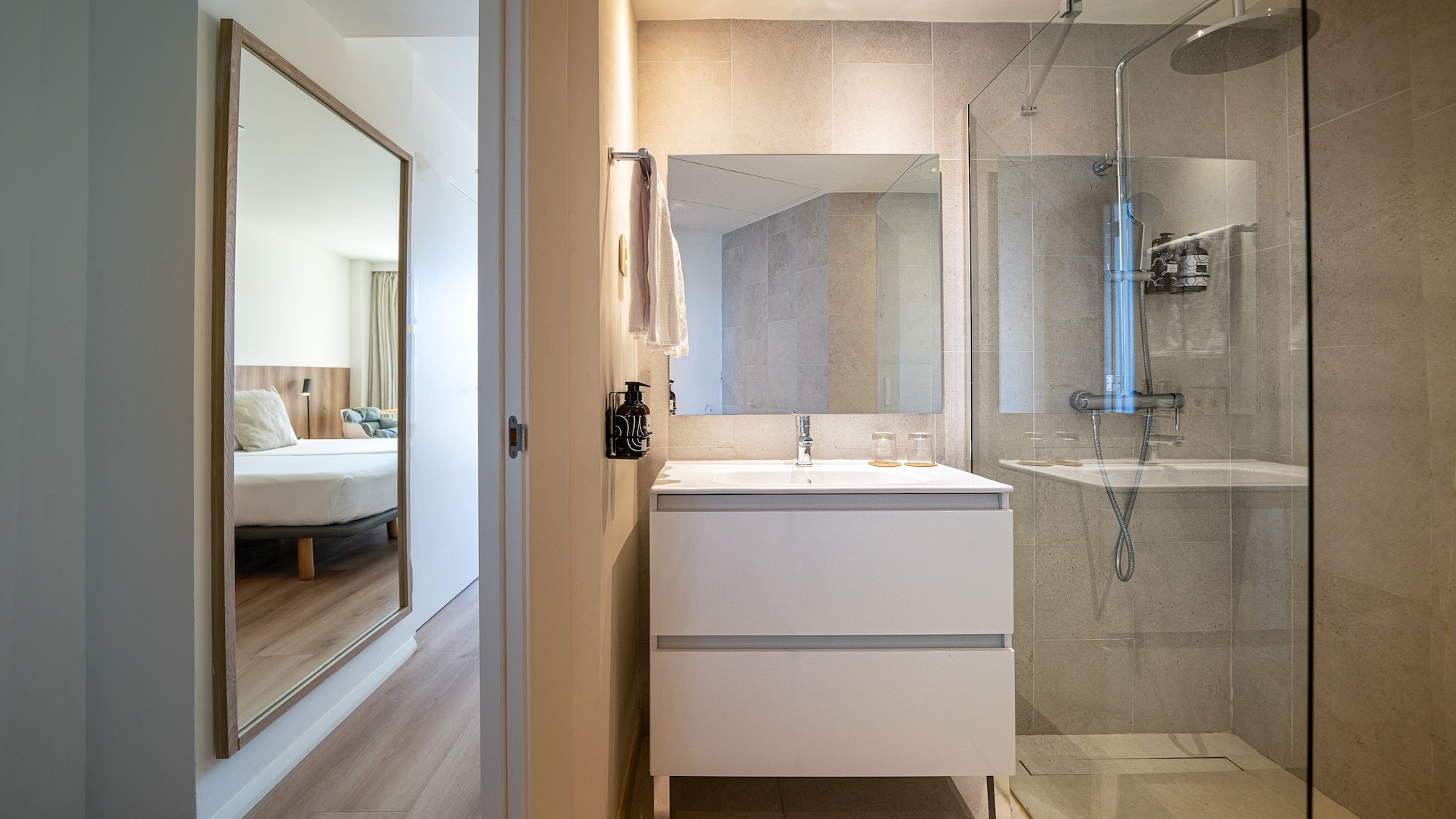a bathroom with a mirror and a sink