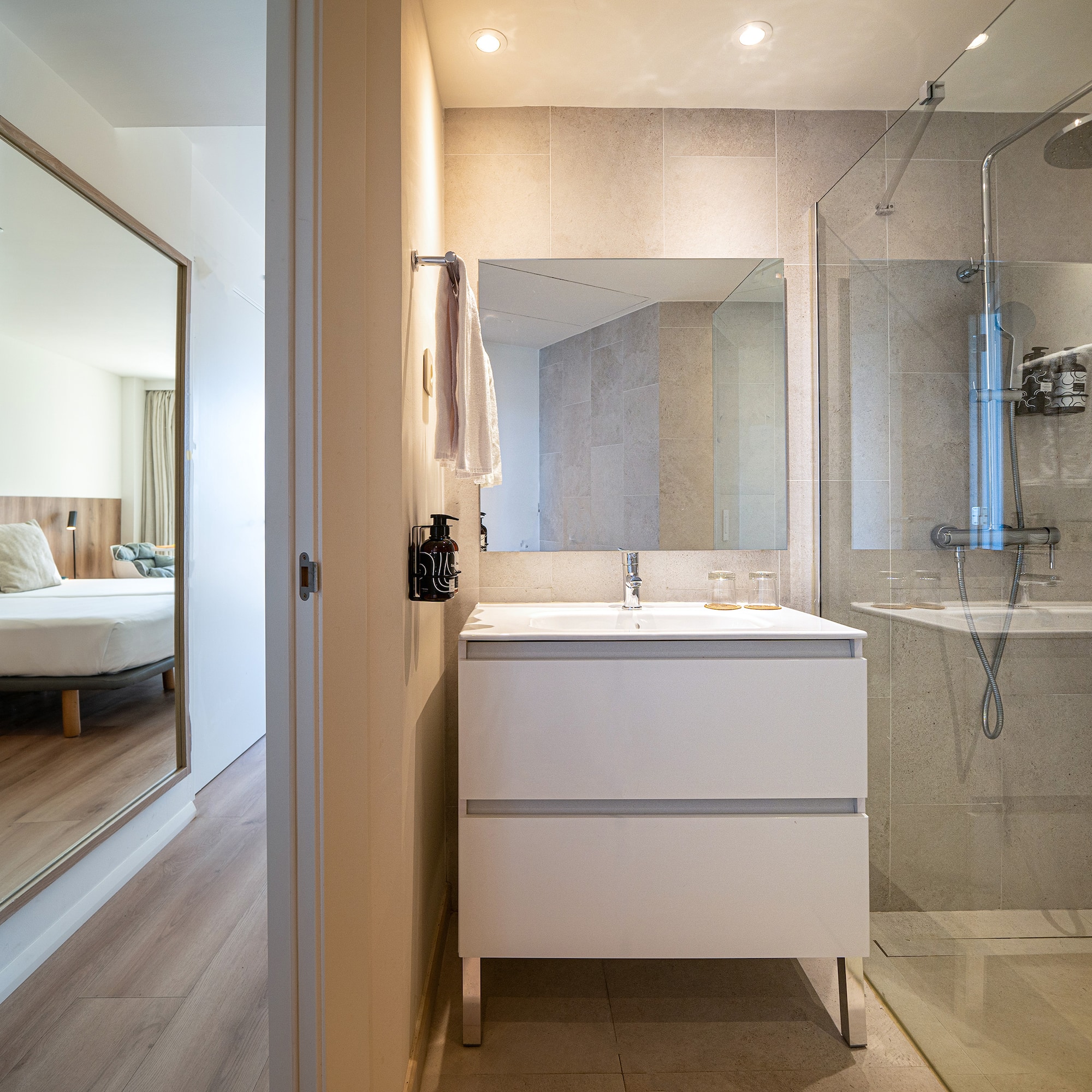 a bathroom with a mirror and a sink