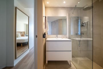 a bathroom with a mirror and a sink