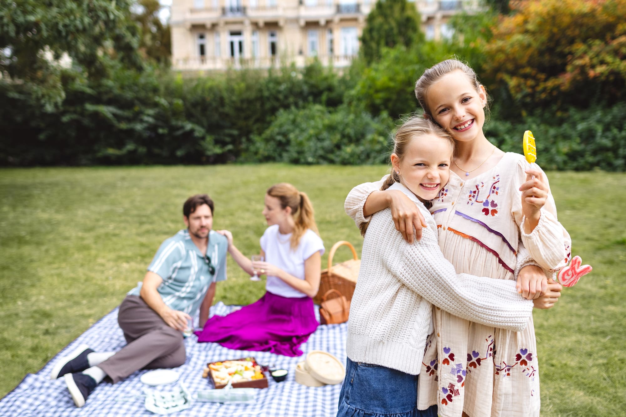 a group of people on a picnic blanket