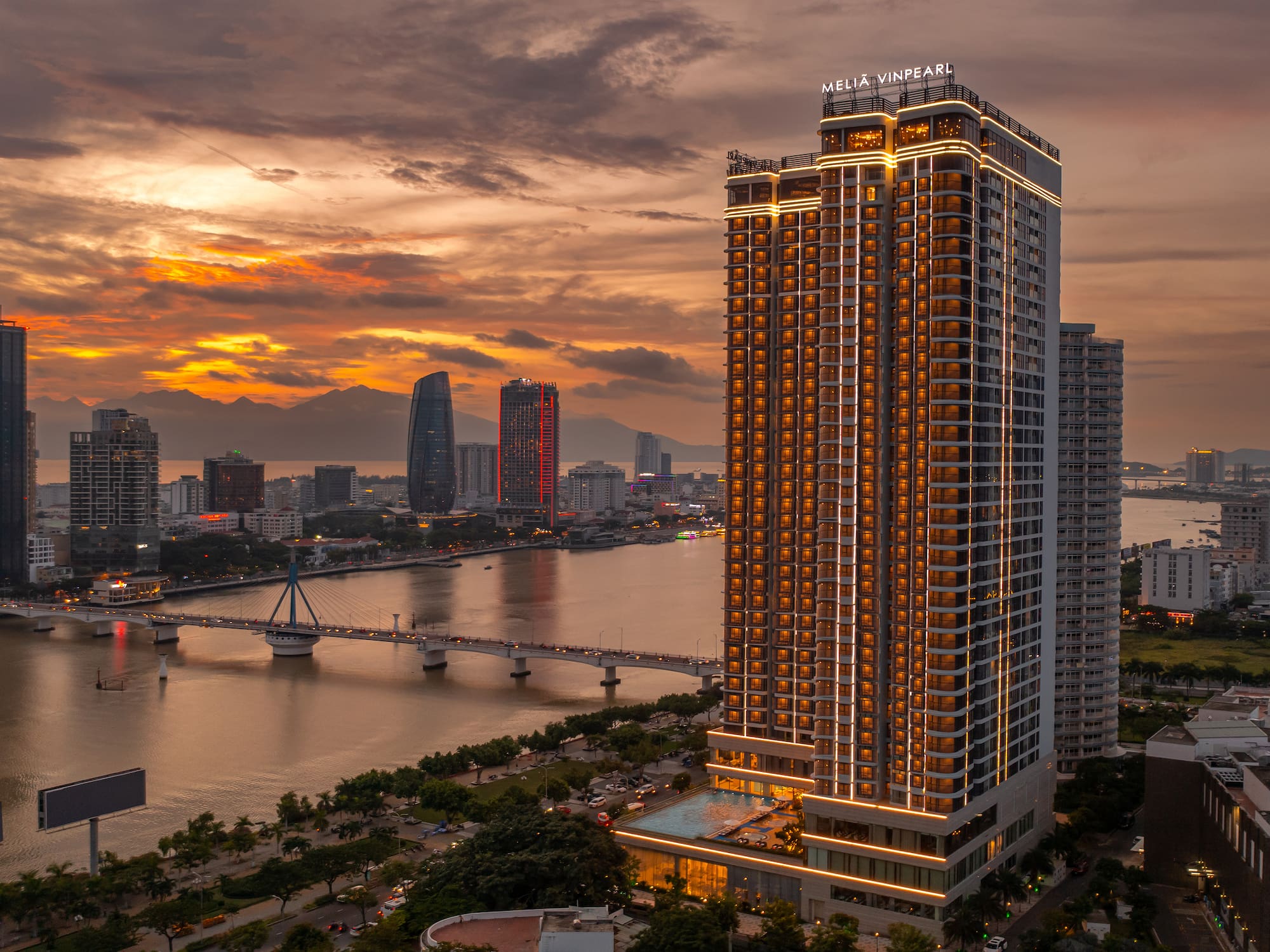 a city with a bridge and a river