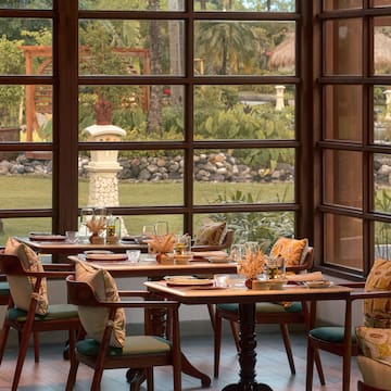 a restaurant with tables and chairs