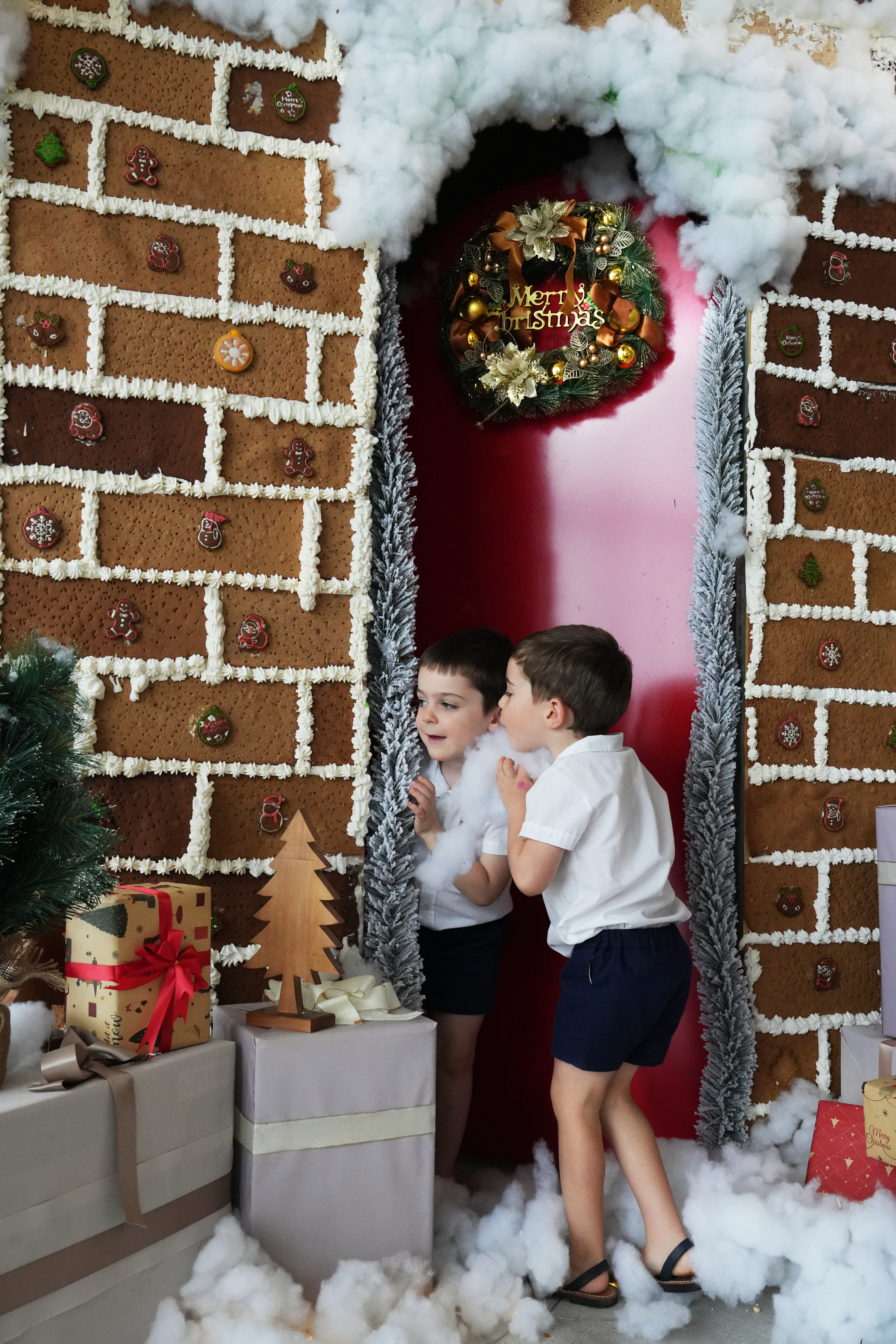 two boys standing in a doorway