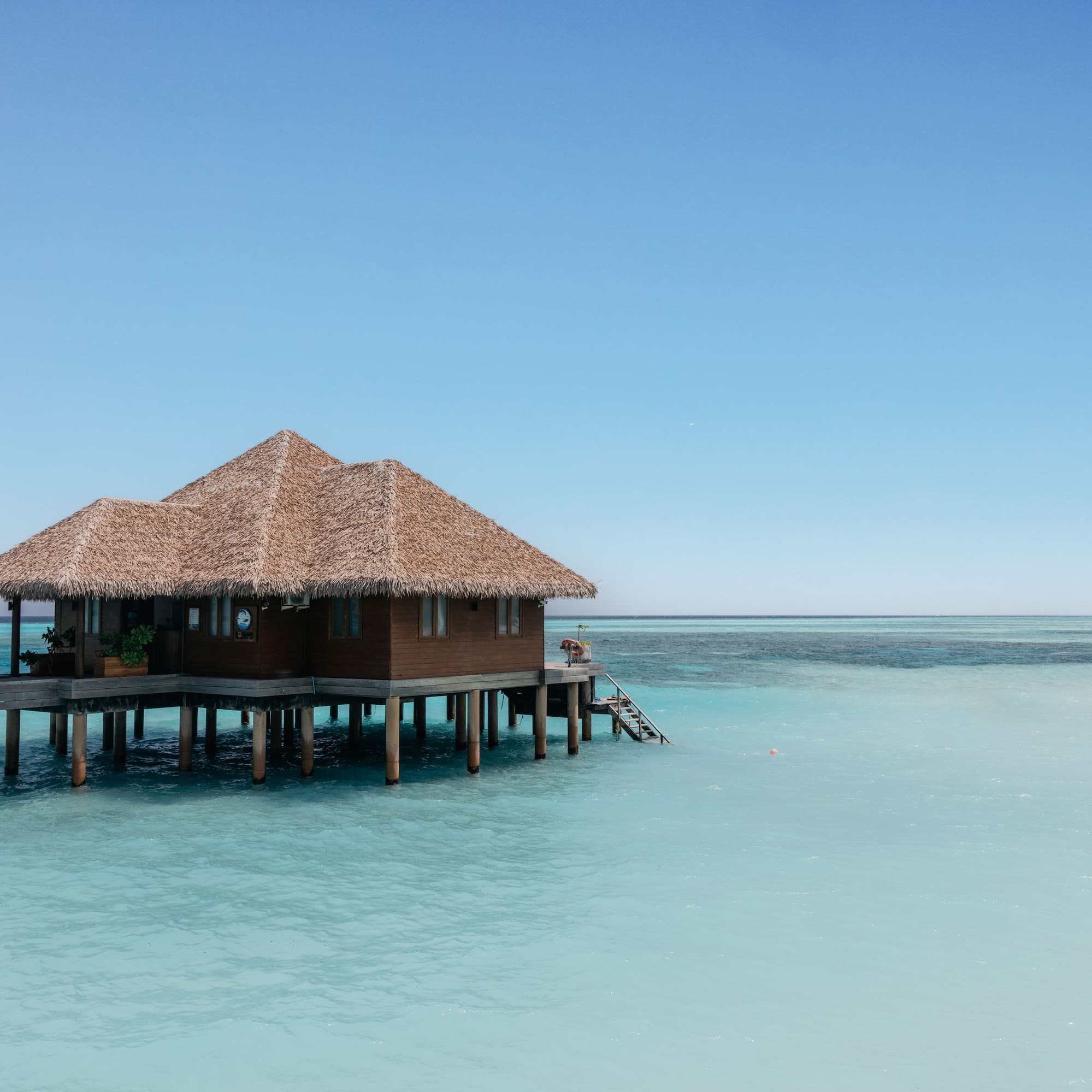 a building on stilts in the water