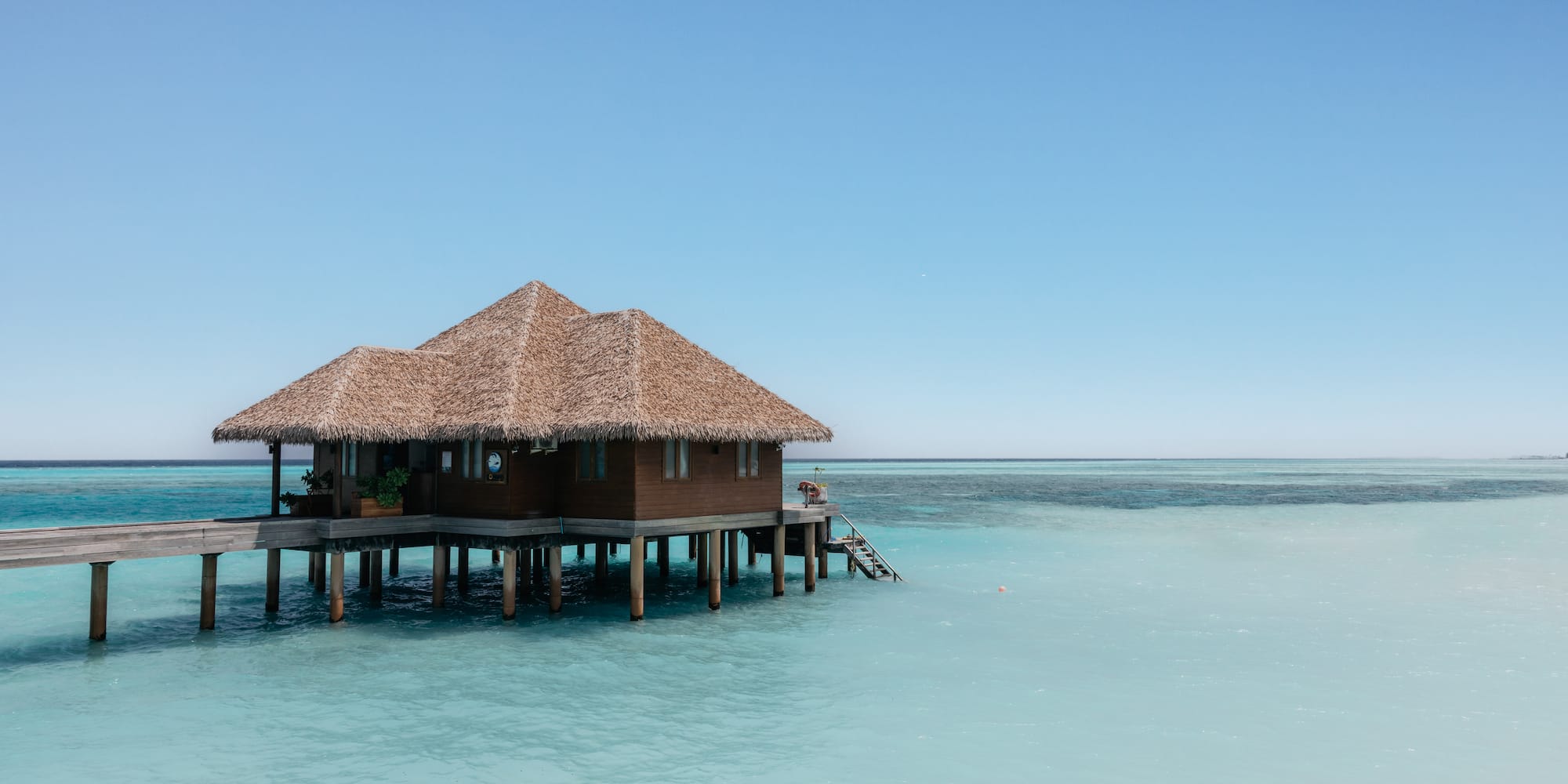 a building on stilts in the water