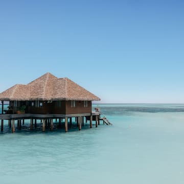 a building on stilts in the water