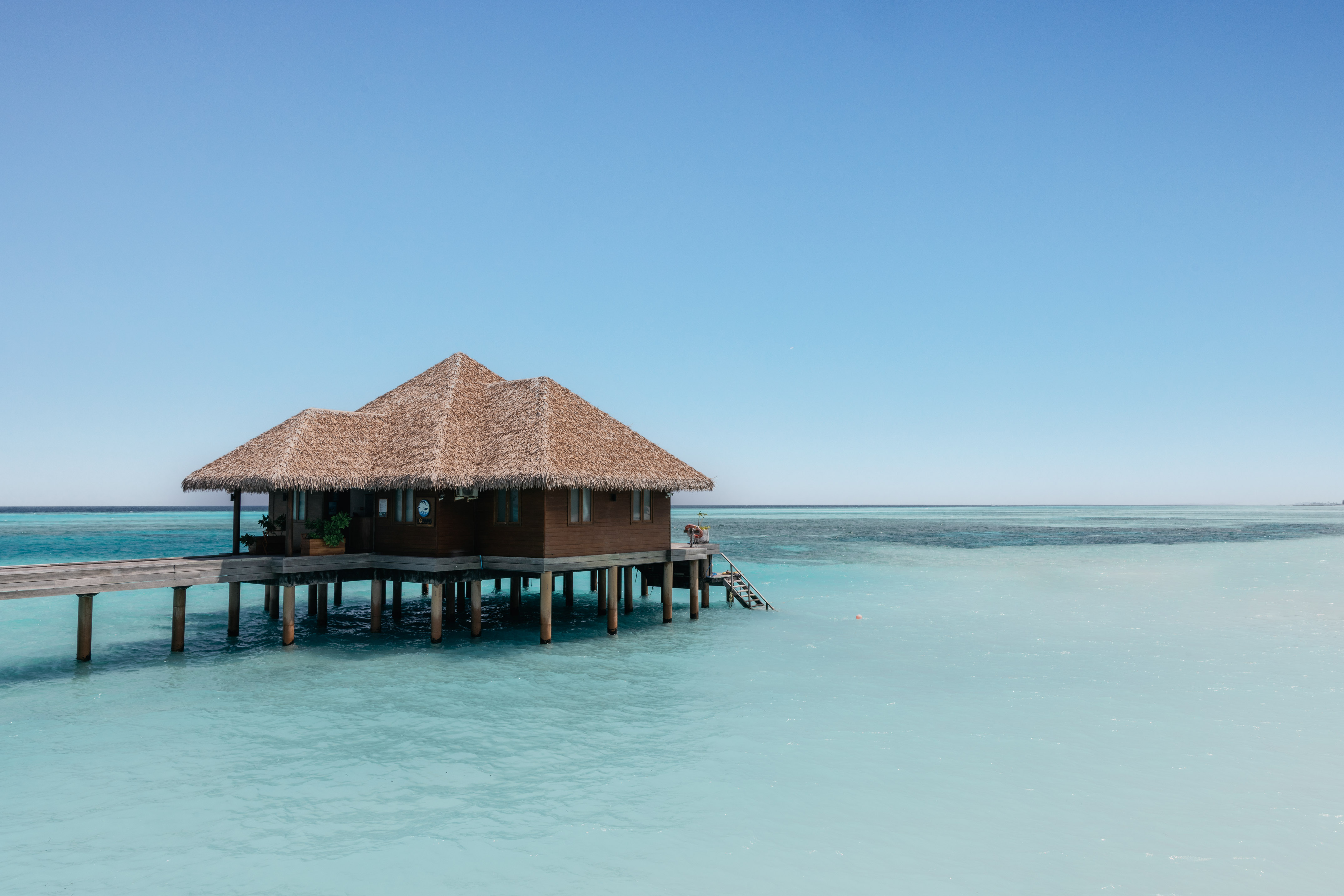 a building on stilts in the water