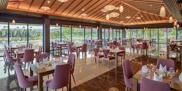 a restaurant with tables and chairs