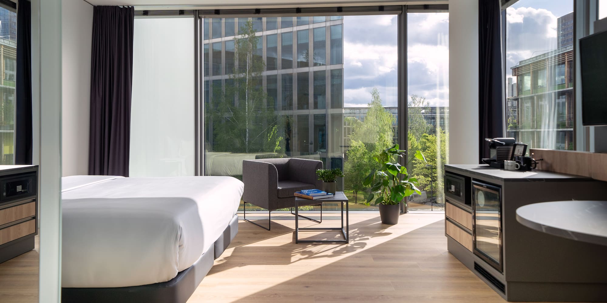 a room with a bed and a stove and a chair