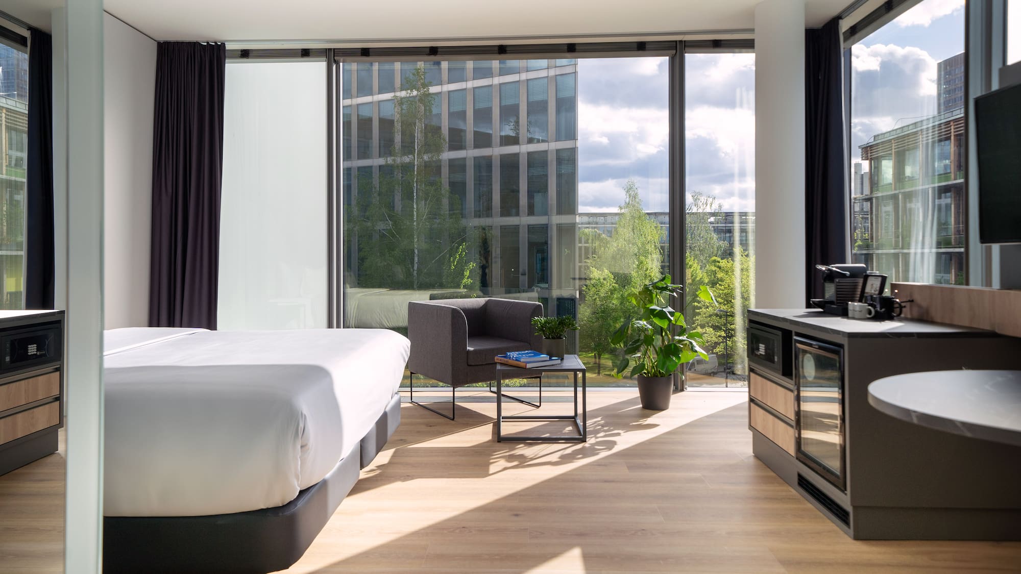 a room with a bed and a stove and a chair