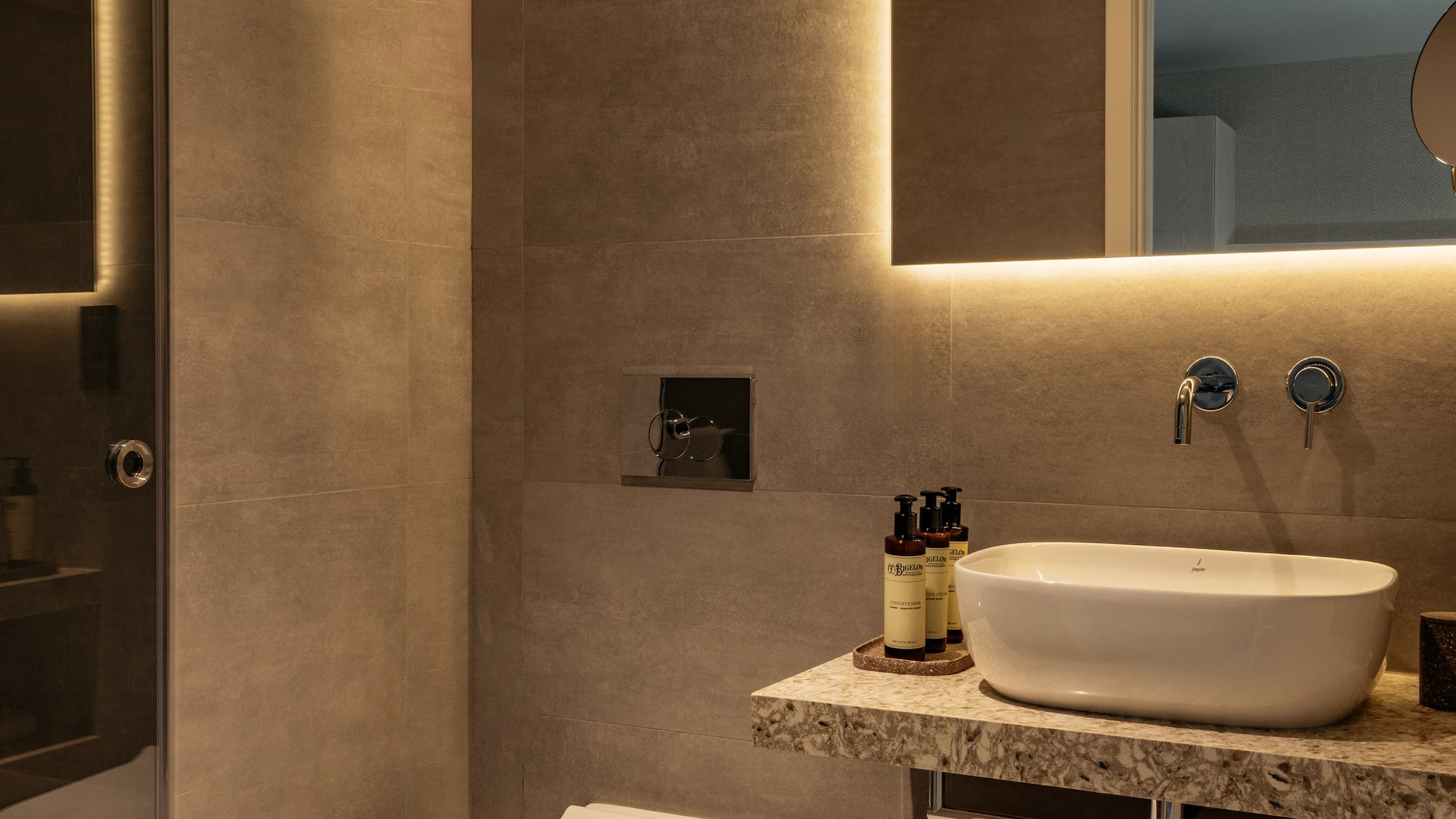 a bathroom with a sink and toilet