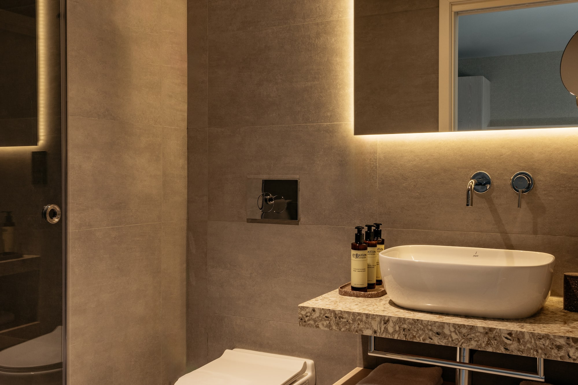 a bathroom with a sink and toilet