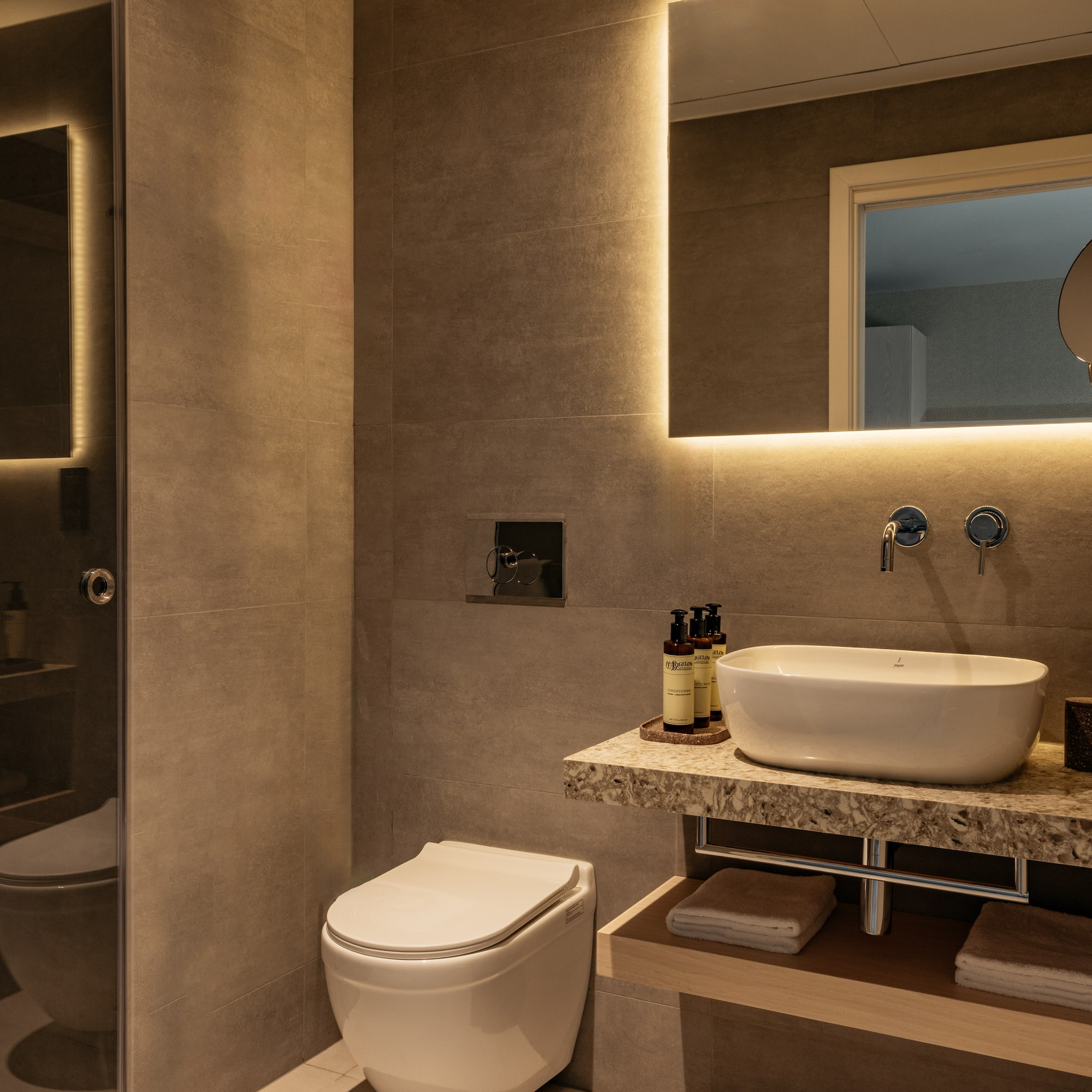 a bathroom with a sink and toilet