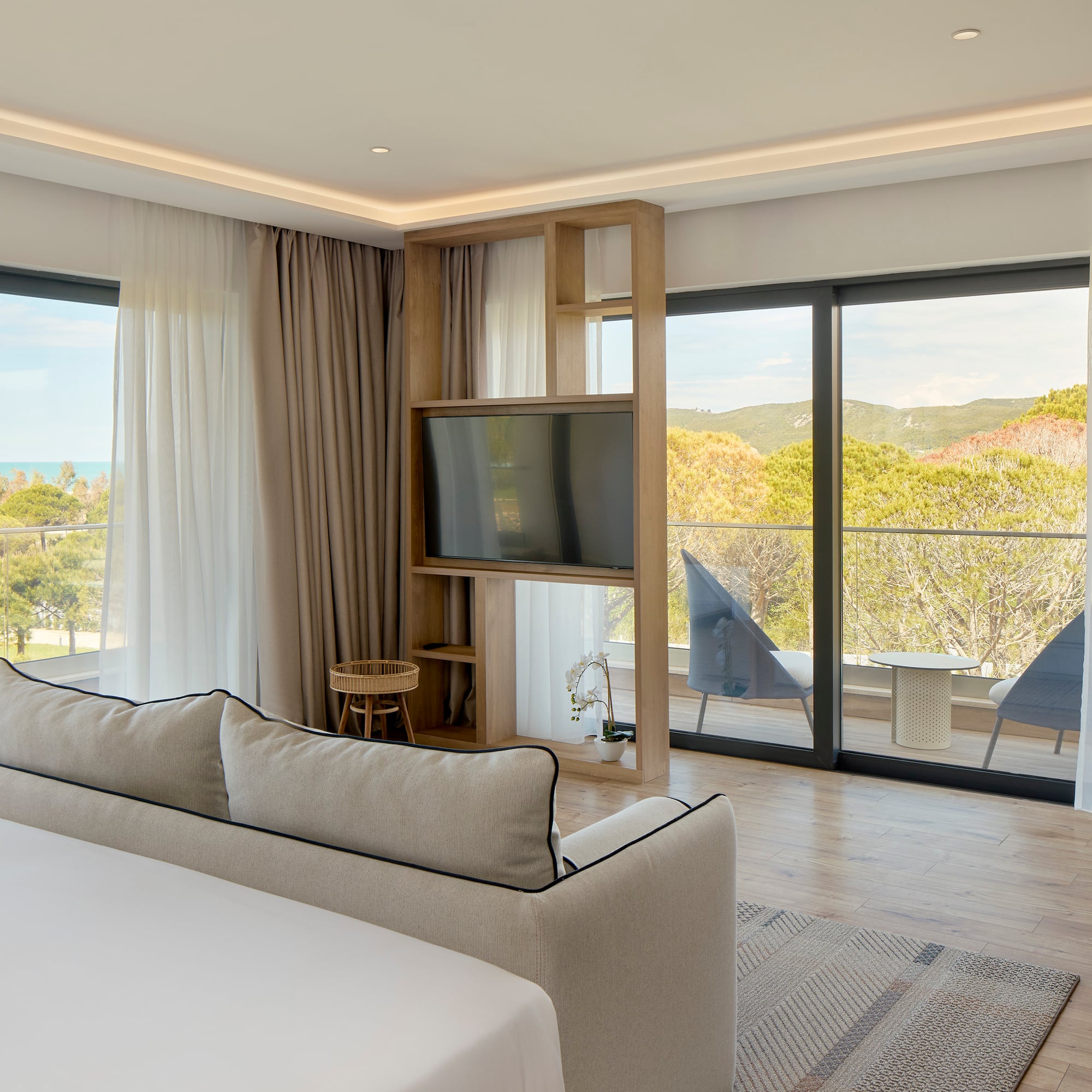 a room with a television and a bed