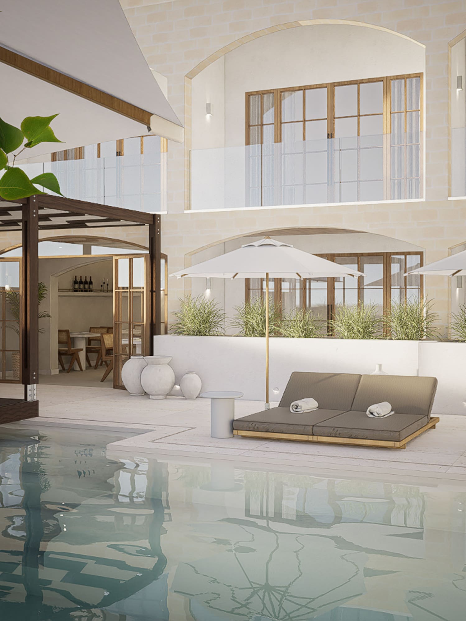 a pool with chairs and umbrellas in a building