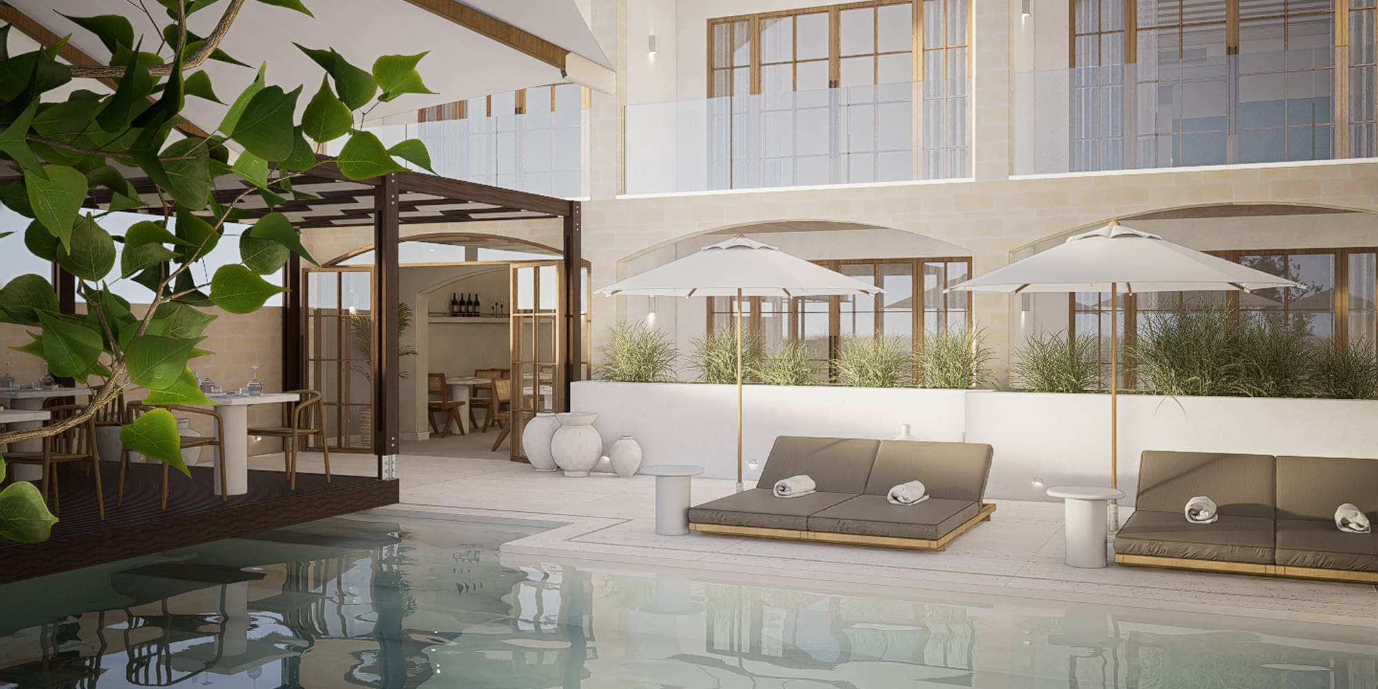 a pool with chairs and umbrellas in a building