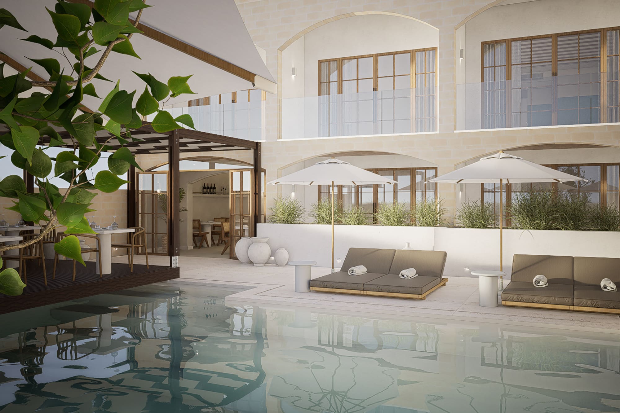 a pool with chairs and umbrellas in a building