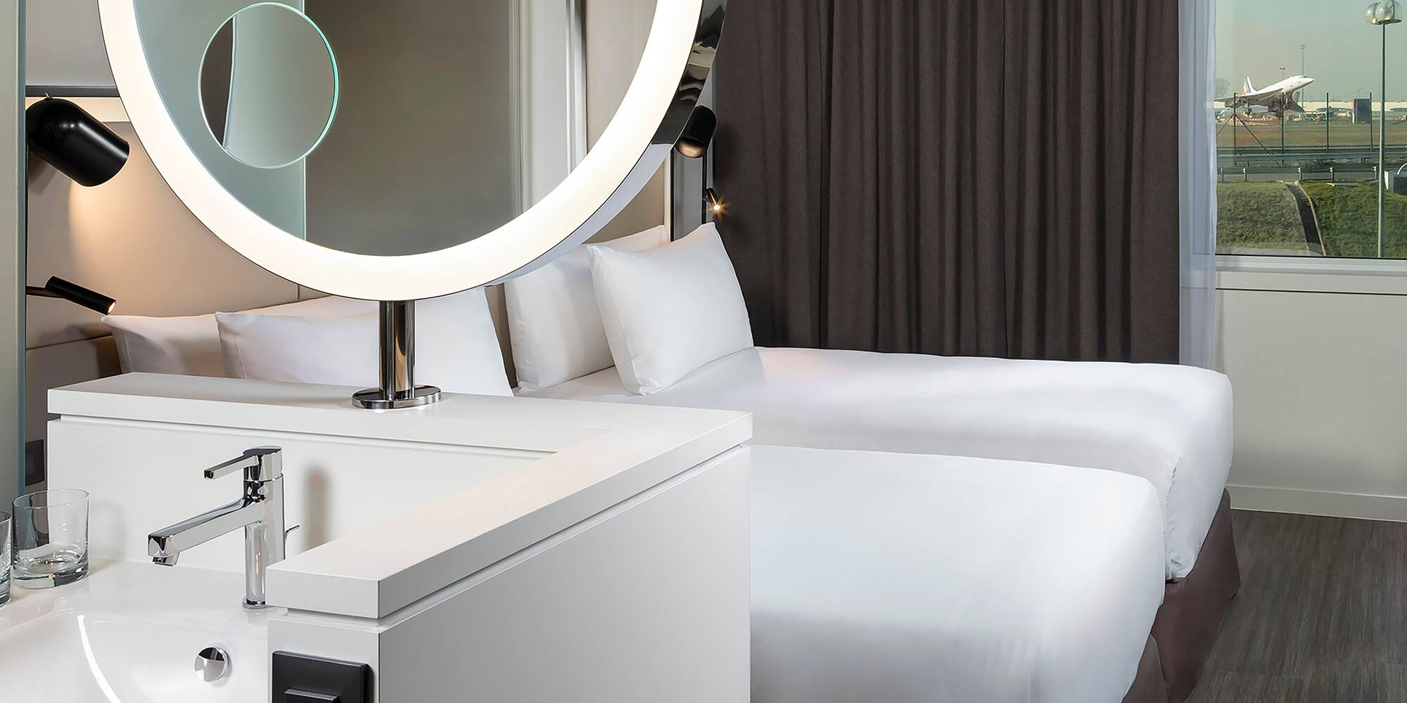 a mirror above a bed
