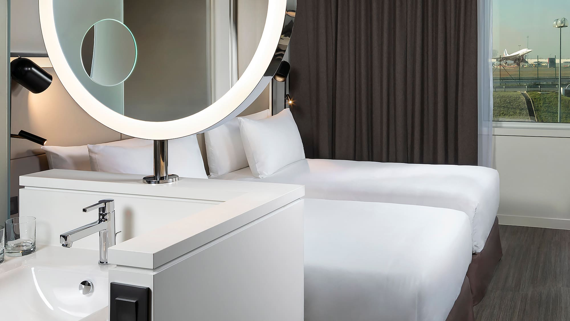 a mirror above a bed