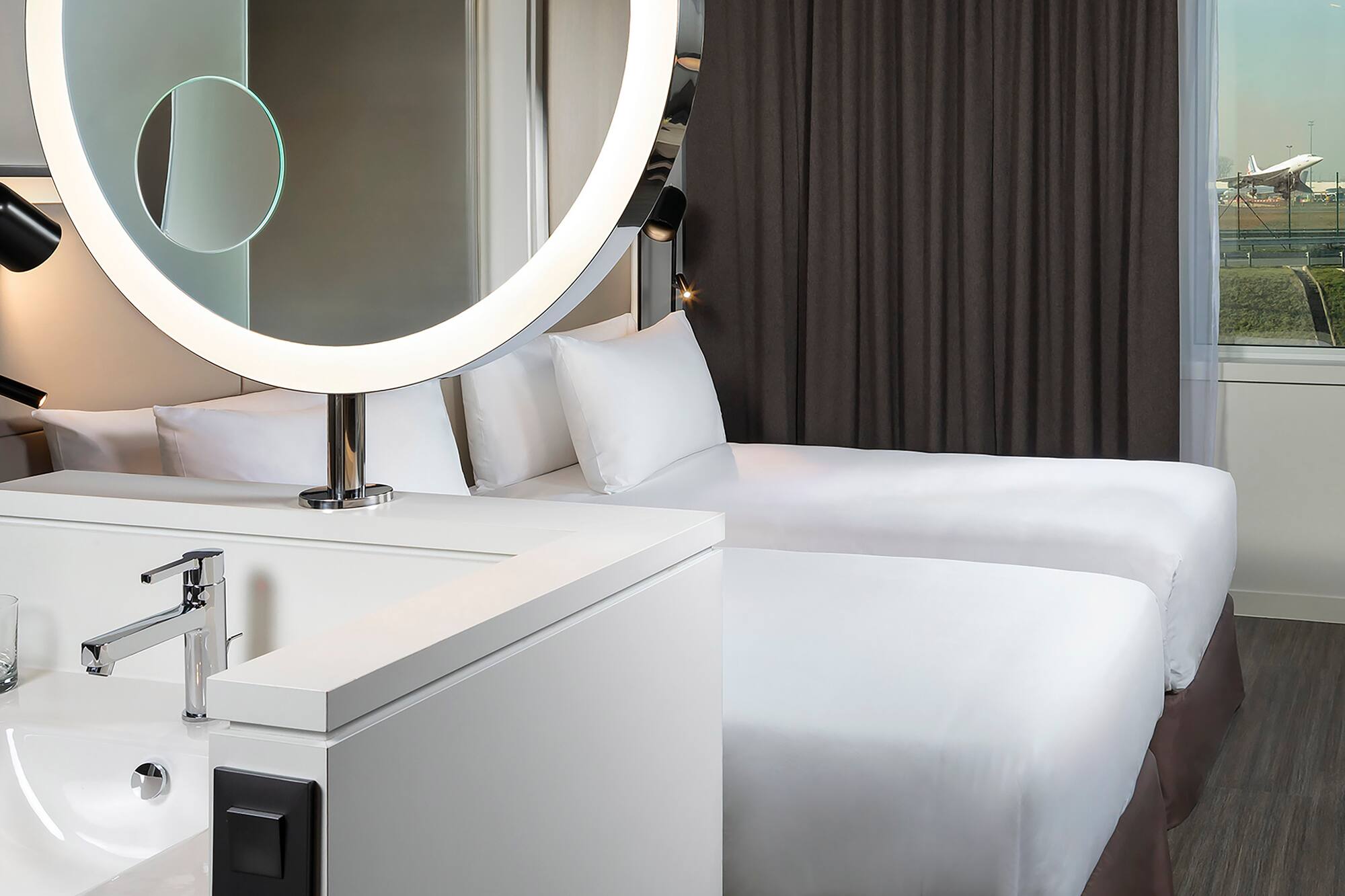 a mirror above a bed