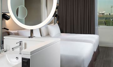 a mirror above a bed