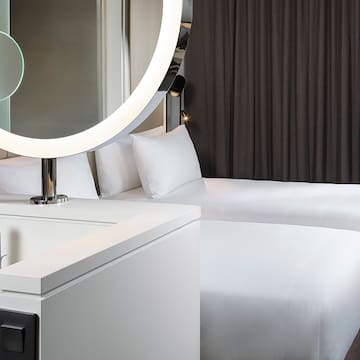 a mirror above a bed