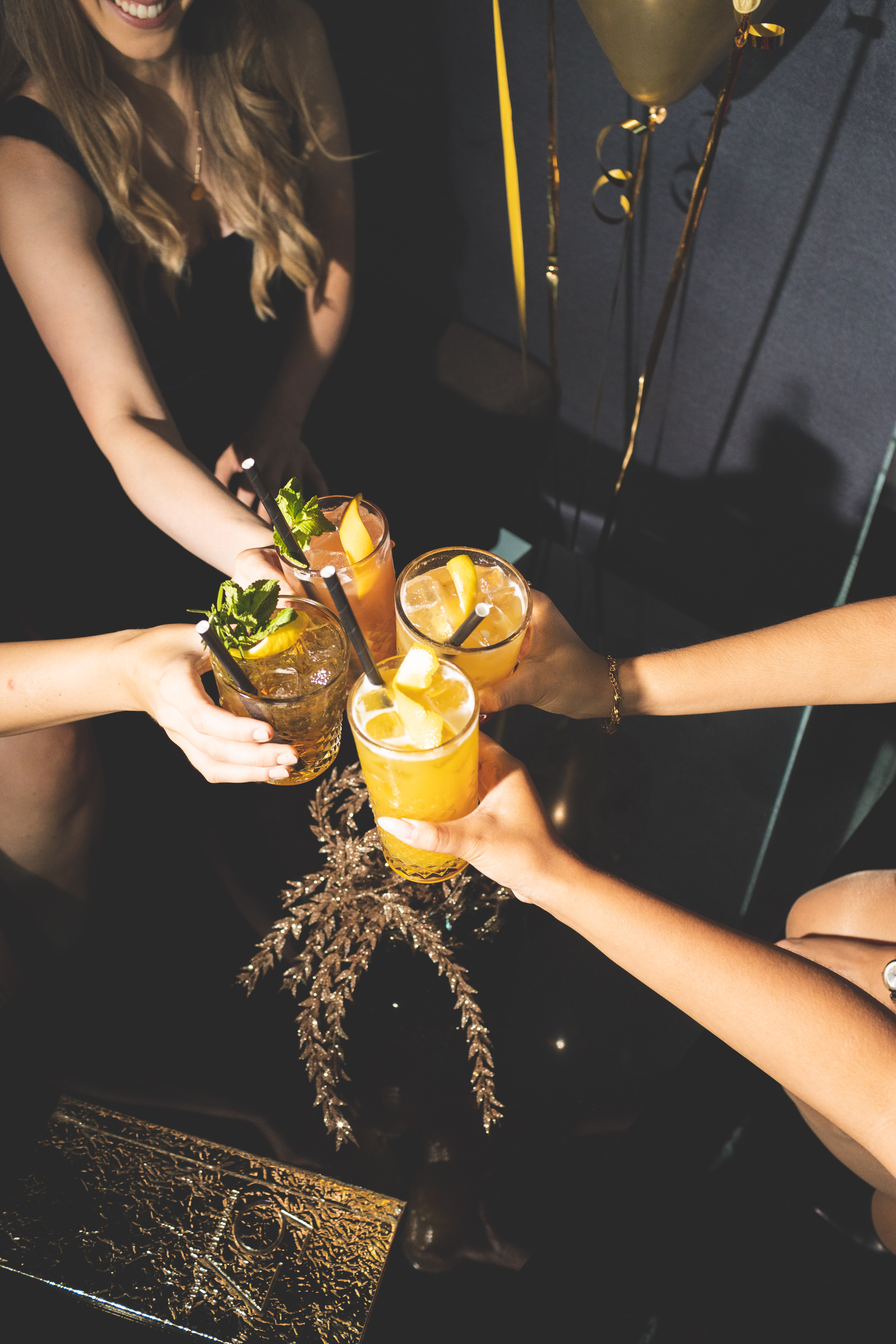 a group of people holding drinks