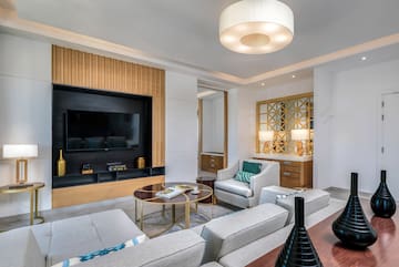 a room with a television and couches