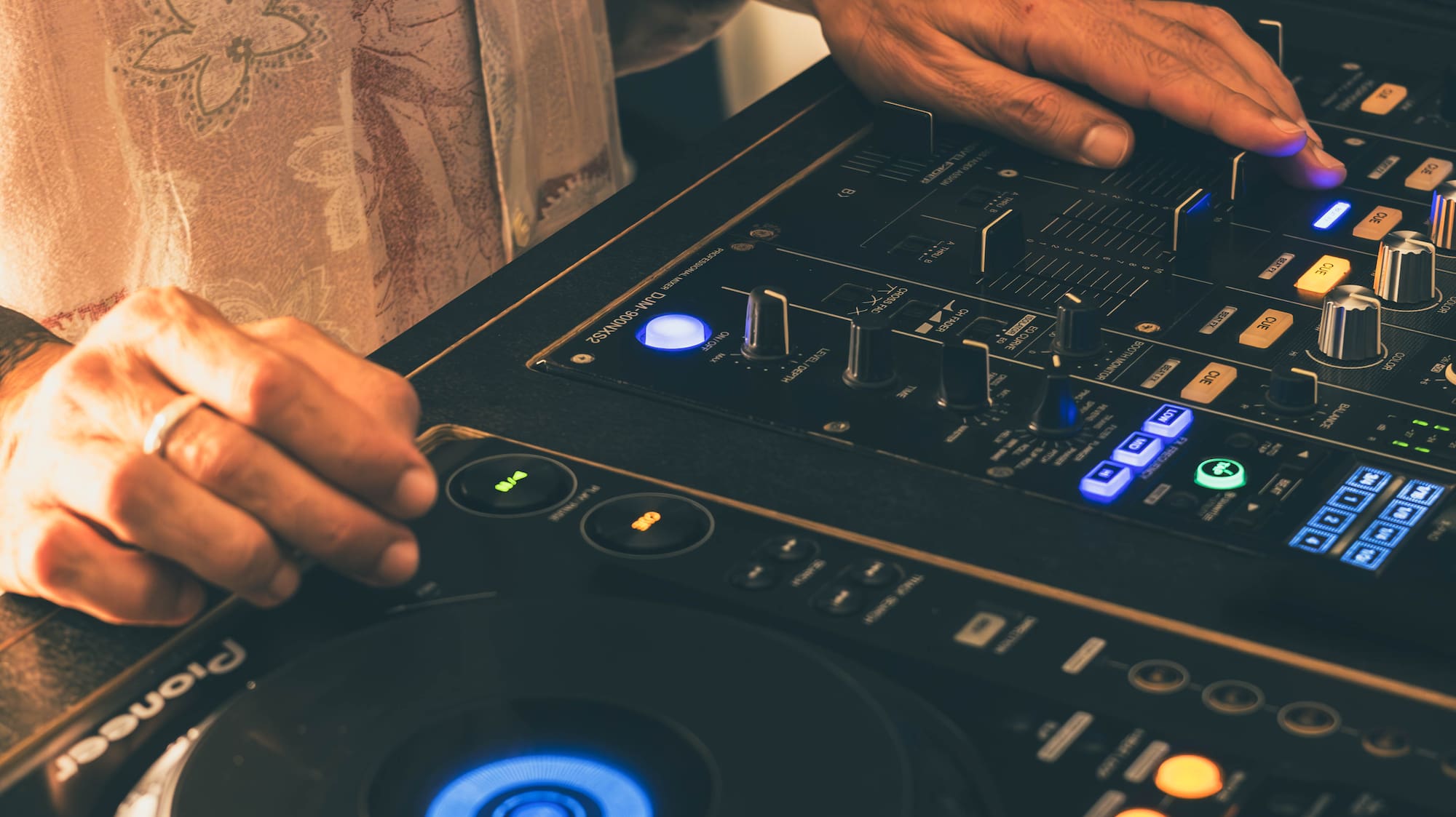 a person using a dj mixer