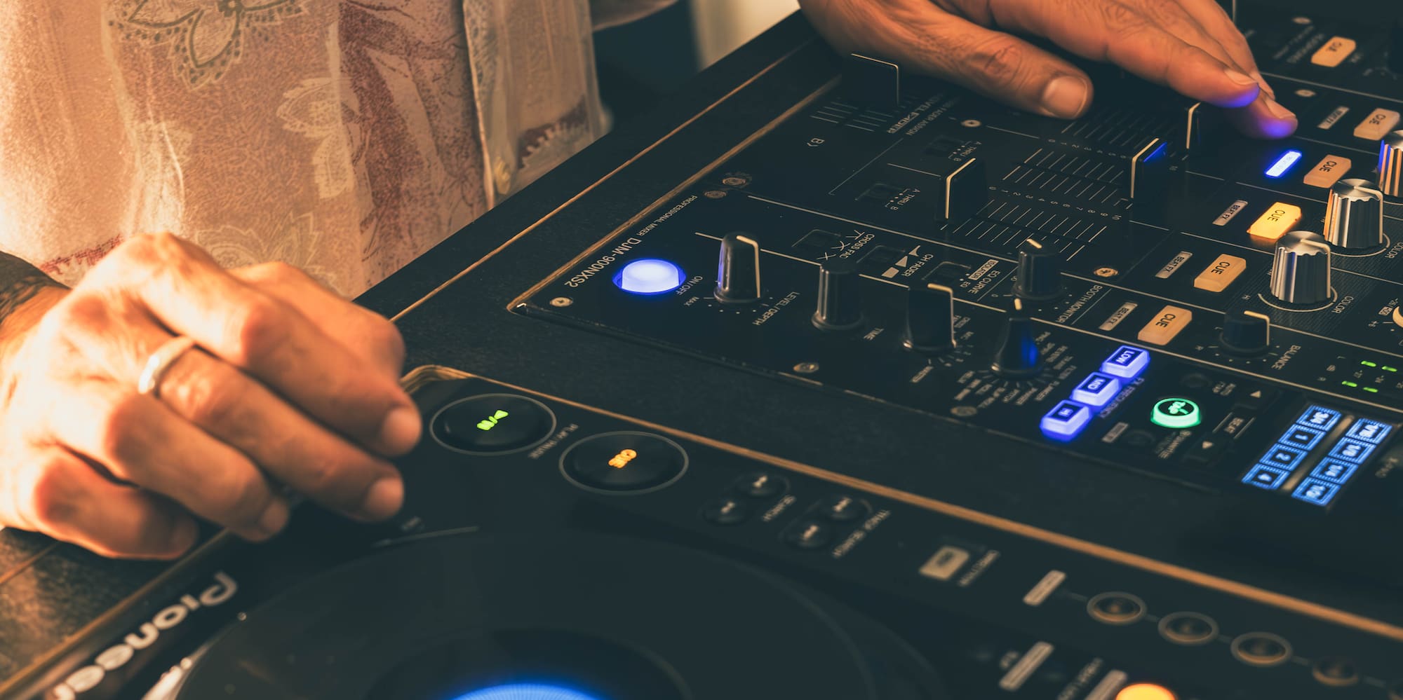 a person using a dj mixer