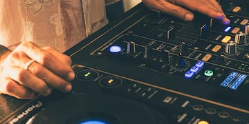 a person using a dj mixer