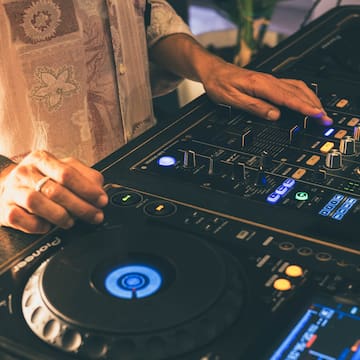 a person using a dj mixer