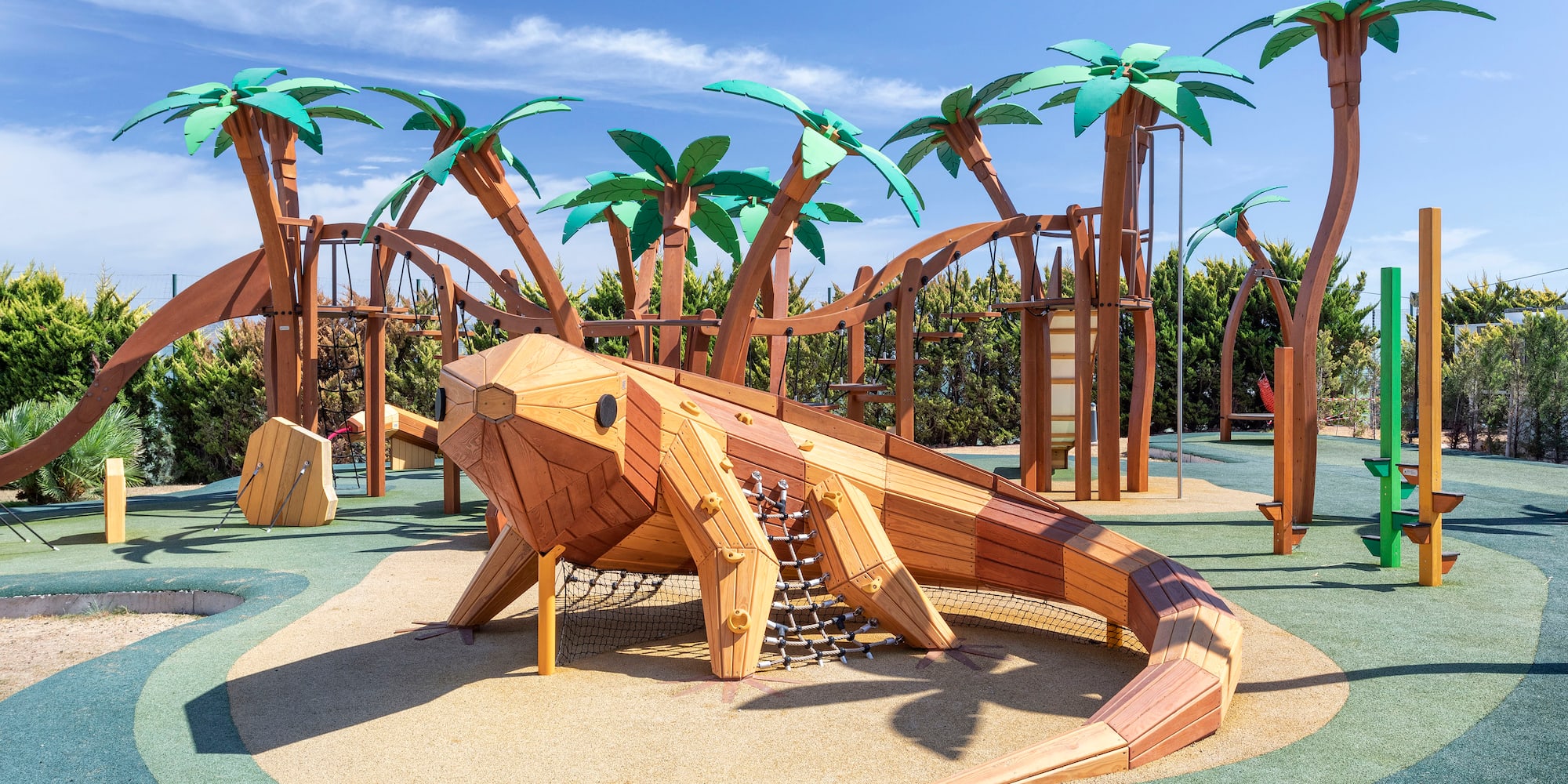 a wooden lizard on a playground