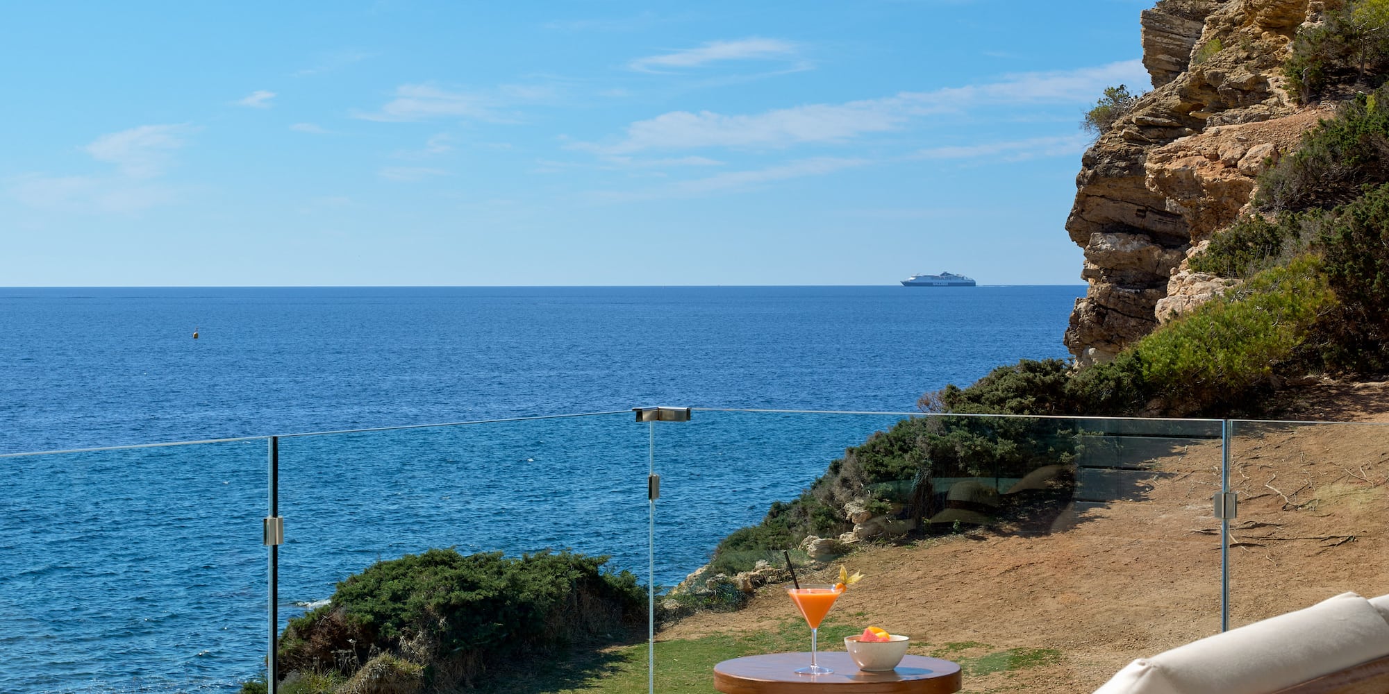 a lounge chair overlooking the ocean