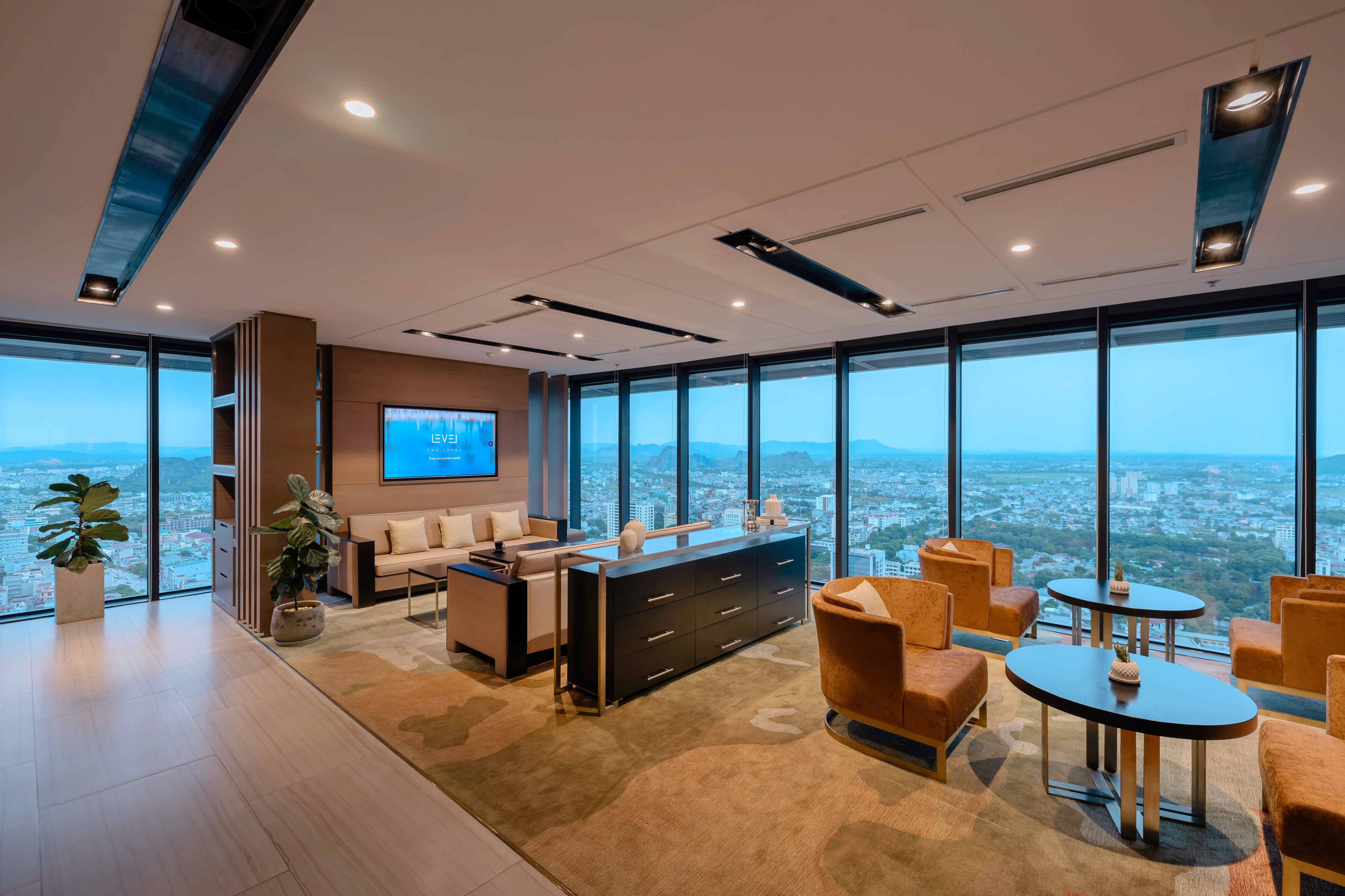 Luxury lounge with panoramic city views, modern design, and comfortable seating.
