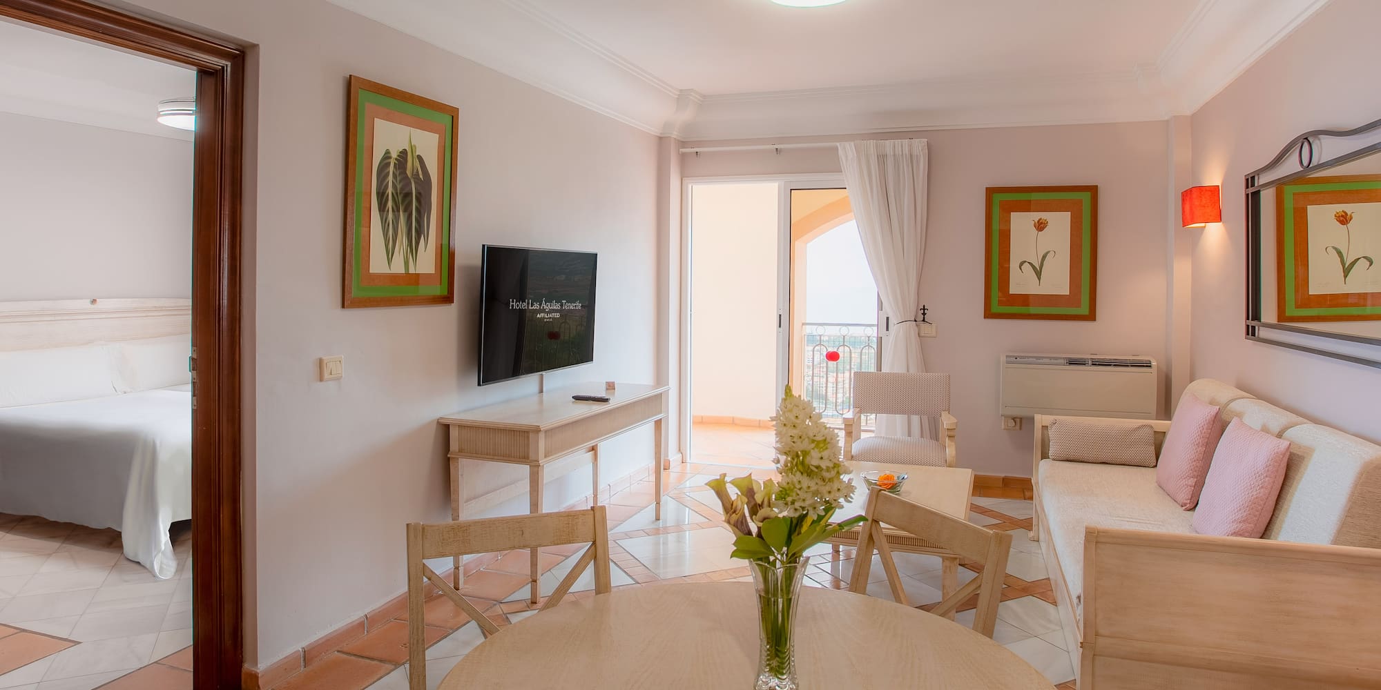 a living room with a television and a table