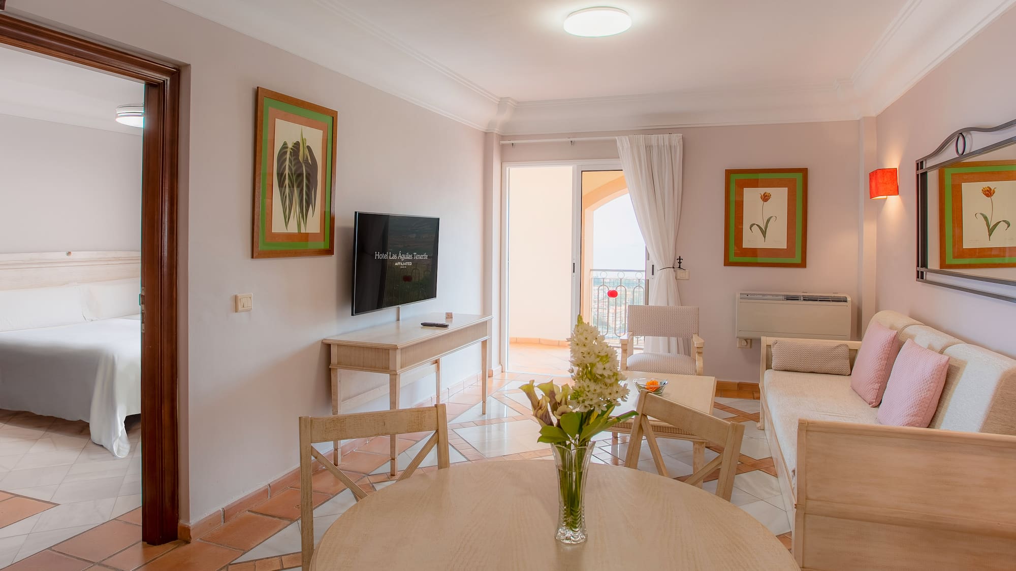 a living room with a television and a table
