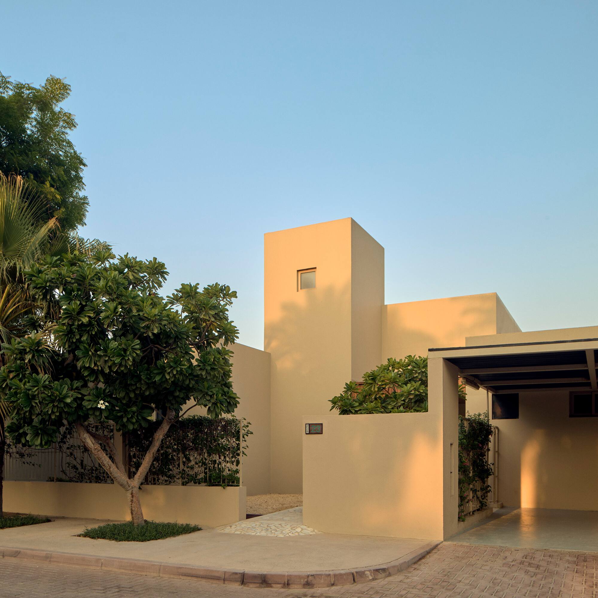 a house with trees and a driveway