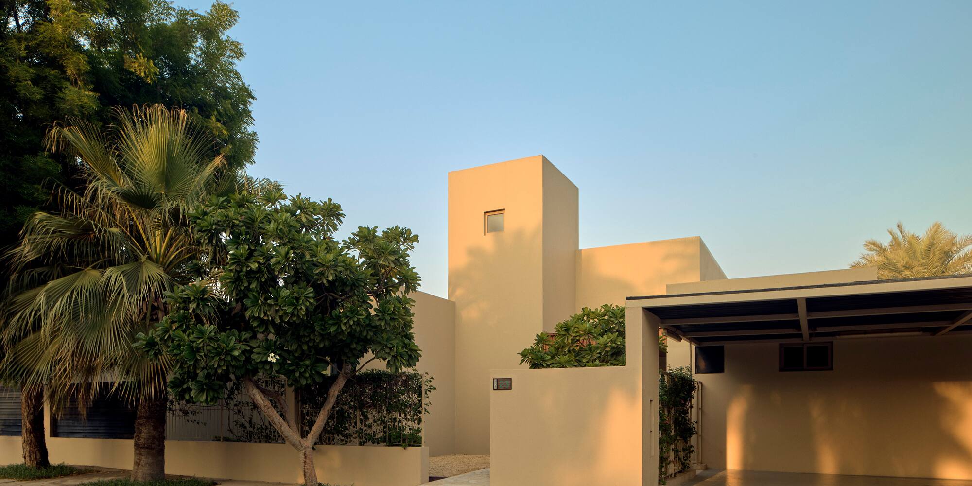 a house with trees and a driveway