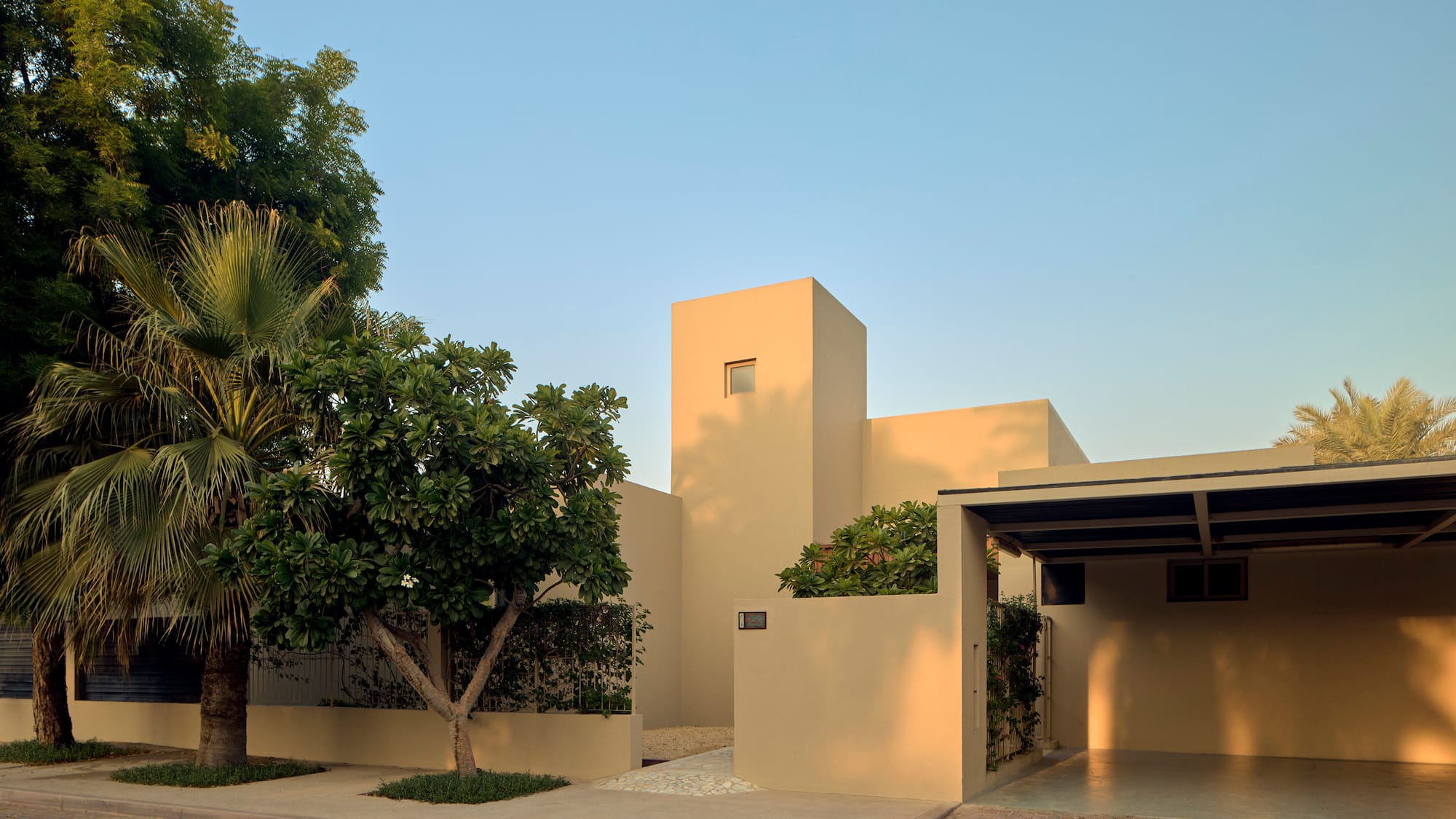 a house with trees and a driveway