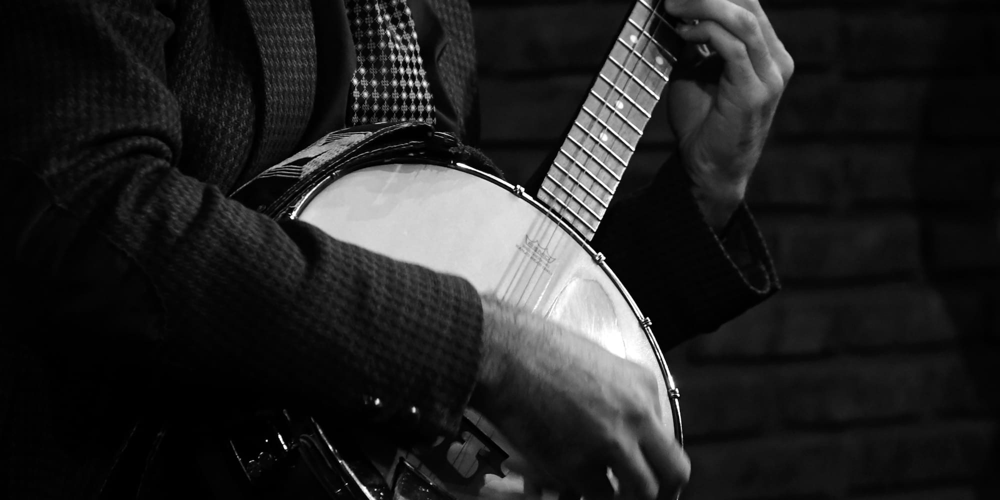 a man playing a banjo