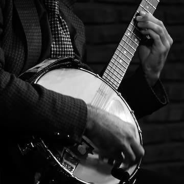 a man playing a banjo